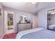 View of a bedroom with ensuite bathroom, and an antique dresser with a large mirror at 3701 5Th Ave # 1, Holmes Beach, FL 34217