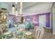 Open-concept dining area featuring modern lighting and seamless flow into the living room at 3701 5Th Ave # 1, Holmes Beach, FL 34217