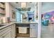 Modern kitchen showcasing stainless steel appliances and open access to the adjacent living area at 3701 5Th Ave # 1, Holmes Beach, FL 34217