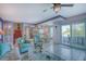 Bright living room featuring comfortable seating, tile floors, and sliding glass doors at 3701 5Th Ave # 1, Holmes Beach, FL 34217
