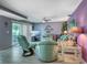 Cozy living room filled with comfortable seating and a ceiling fan at 3701 5Th Ave # 1, Holmes Beach, FL 34217