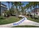 Pathway leading to the beach lined with palm trees at 3701 5Th Ave # 1, Holmes Beach, FL 34217