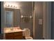Cozy full bathroom with a single vanity, toilet, and neutral-toned walls at 3784 Parkridge Cir # 22-203, Sarasota, FL 34243