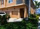 Inviting townhouse with manicured landscaping, two-car garage, and appealing architectural details at 3784 Parkridge Cir # 22-203, Sarasota, FL 34243