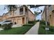 Inviting townhome with lush landscaping, private garage, and a screened balcony, perfect for relaxing at 3784 Parkridge Cir # 22-203, Sarasota, FL 34243