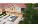 Well kept townhome with private garage, landscaped driveway, covered patio and a nearby community pond at 3784 Parkridge Cir # 22-203, Sarasota, FL 34243