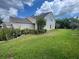 Charming home exterior with lush landscaping, and a well-manicured lawn at 4111 34Th St E, Bradenton, FL 34208