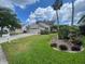 Charming single-story home featuring a well-maintained lawn and lush landscaping at 4111 34Th St E, Bradenton, FL 34208
