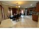 Open-concept kitchen and dining area with stainless steel appliances and tile flooring at 4111 34Th St E, Bradenton, FL 34208