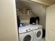 A functional laundry area with modern white appliances and ample storage space at 4111 34Th St E, Bradenton, FL 34208
