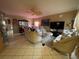 Comfortable living room with tile floors, ceiling fan, and ornate furniture at 4111 34Th St E, Bradenton, FL 34208