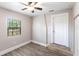 Bedroom featuring ceiling fan, wood flooring, and a window providing natural light at 4347 9Th N Ave, St Petersburg, FL 33713