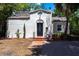 Charming Spanish-style home featuring a red-tiled roof, stucco exterior, and decorative front door with brick path at 4347 9Th N Ave, St Petersburg, FL 33713
