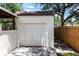 Exterior view of the one-car garage with a white door and tile roof at 4347 9Th N Ave, St Petersburg, FL 33713