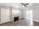 Bright living room showcases a decorative stone fireplace with wood-look tile flooring, perfect for entertaining at 4347 9Th N Ave, St Petersburg, FL 33713