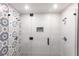 Modern shower featuring dual shower heads, glass enclosure and decorative tiling at 4347 9Th N Ave, St Petersburg, FL 33713