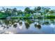 Picturesque view of the waterfront featuring a tranquil canal reflecting the surrounding landscape and homes at 4512 26Th S Ave, Tampa, FL 33619
