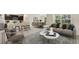 Open-concept living space with a comfortable sofa, dining area, and bright kitchen, perfect for entertaining at 4517 Dusky Dawn Ln, Palmetto, FL 34221