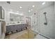 Modern bathroom featuring double vanity sinks, tiled shower, and updated fixtures at 4636 Pine Harrier Dr, Sarasota, FL 34231