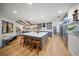 Spacious kitchen with a large center island, modern appliances, hardwood floors, and an open floorplan layout at 4636 Pine Harrier Dr, Sarasota, FL 34231
