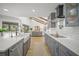 Contemporary kitchen boasting gray cabinetry, stainless steel appliances, and an open design at 4636 Pine Harrier Dr, Sarasota, FL 34231