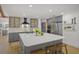 Modern kitchen featuring gray cabinets, a large island, stainless steel appliances, and sleek countertops at 4636 Pine Harrier Dr, Sarasota, FL 34231