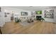 Inviting living room with hardwood floors, fireplace, and built-in shelving at 4636 Pine Harrier Dr, Sarasota, FL 34231
