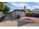 Backyard featuring a gravel area, concrete slab, privacy fence, and house exterior at 4812 21St W St, Bradenton, FL 34207