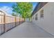 Backyard featuring a large concrete area, privacy fence, and the house's exterior at 4812 21St W St, Bradenton, FL 34207