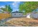 Backyard featuring lawn, shed, wooden fence, and the exterior of the house at 4812 21St W St, Bradenton, FL 34207