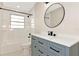 Updated bathroom showcases vanity, black fixtures, tub and a shower combination at 4812 21St W St, Bradenton, FL 34207