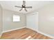 The bright bedroom is with wood-look flooring, closet, and a ceiling fan at 4812 21St W St, Bradenton, FL 34207
