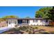 Charming single-story home with a blue front door, black accents, and newly landscaped front yard at 4812 21St W St, Bradenton, FL 34207