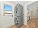 Convenient laundry room features stacked washer and dryer, utility sink and access to the backyard at 4812 21St W St, Bradenton, FL 34207