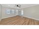 Inviting living room features wood-look flooring and access to an adjacent room and front entry at 4812 21St W St, Bradenton, FL 34207