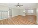 Spacious living room boasts natural light, wood-look flooring, and ceiling fans at 4812 21St W St, Bradenton, FL 34207