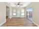 Living room featuring wood-look flooring, windows, and a sliding glass door to the backyard at 4812 21St W St, Bradenton, FL 34207