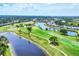 Picturesque aerial shot of a meticulously maintained golf course with water features and manicured greenery at 5217 Chase Oaks Dr, Sarasota, FL 34241