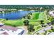 Beautiful aerial view of a golf course, lake, and residential area at 5217 Chase Oaks Dr, Sarasota, FL 34241