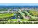 Scenic aerial view of the golf course and community with lush greenery and several ponds at 5217 Chase Oaks Dr, Sarasota, FL 34241