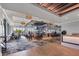The community clubhouse bar has modern lighting, a decorative ceiling, several tv screens, and plenty of seating at 5217 Chase Oaks Dr, Sarasota, FL 34241