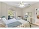 This bedroom offers comfort with a bright window providing natural light at 5217 Chase Oaks Dr, Sarasota, FL 34241