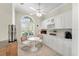 Bright breakfast nook featuring a seating area, ample natural light, and white cabinetry at 5217 Chase Oaks Dr, Sarasota, FL 34241