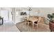 Elegant dining area that leads into the kitchen and living room with neutral colors at 5217 Chase Oaks Dr, Sarasota, FL 34241