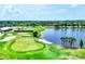 Lush golf course with sand traps, green fairways, and a serene lake view at 5217 Chase Oaks Dr, Sarasota, FL 34241