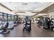 This community gym features cardio and weight equipment, ceiling fans, floor-to-ceiling mirrors and multiple tv screens at 5217 Chase Oaks Dr, Sarasota, FL 34241