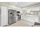 Clean kitchen featuring stainless steel appliances, white cabinetry, and convenient layout at 5217 Chase Oaks Dr, Sarasota, FL 34241