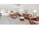 Relaxing living room with comfortable leather seating and view into the dining area at 5217 Chase Oaks Dr, Sarasota, FL 34241