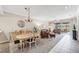 Open concept living space featuring dining and living rooms with access to an outdoor lanai at 5217 Chase Oaks Dr, Sarasota, FL 34241
