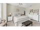 A bright main bedroom featuring neutral colors and is complemented by soft, plush seating at 5217 Chase Oaks Dr, Sarasota, FL 34241